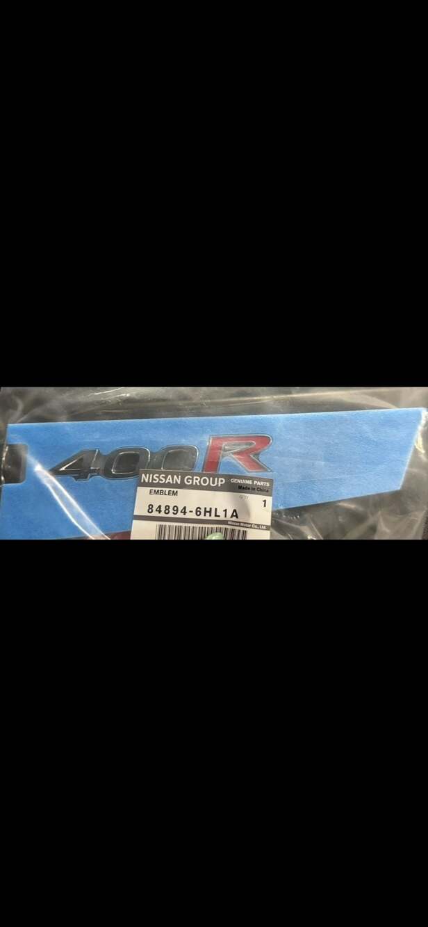 Genuine Nissan 400R Trunk Badge Emblem - Part 84894-6HL1A